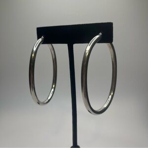 sterling silver over sized oval hoop earrings for pierced ears. Light weight.